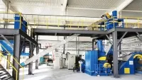 Système de pesage et d'alimentation pour mélangeur interne en atelier de plain-pied